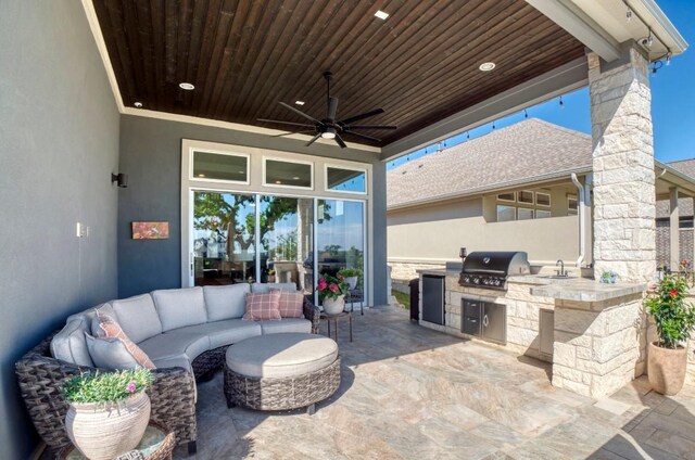 view of patio / terrace with a grill, area for grilling, sink, ceiling fan, and an outdoor living space