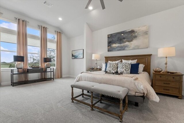 carpeted bedroom featuring lofted ceiling and ceiling fan