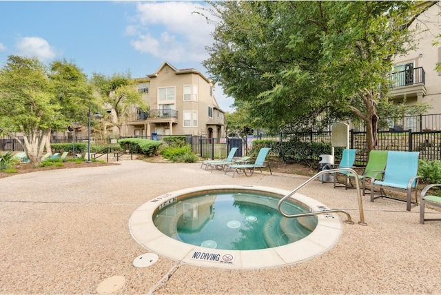 view of swimming pool with a patio area