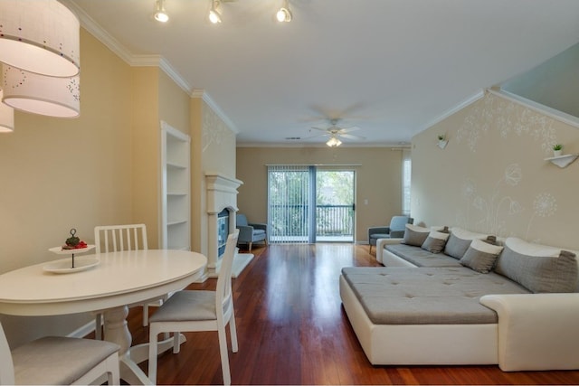 living room featuring crown molding, ceiling fan, and dark hardwood / wood-style flooring