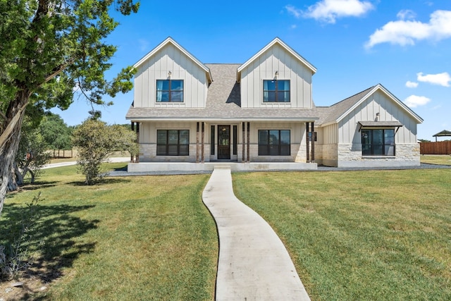 modern farmhouse style home featuring a front lawn and covered porch