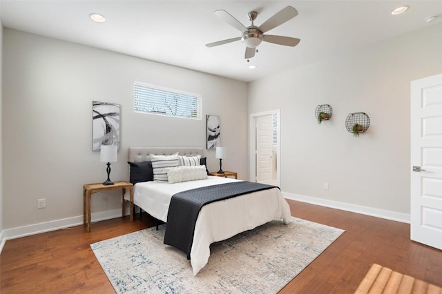 bedroom featuring ceiling fan, dark wood-type flooring, and a closet