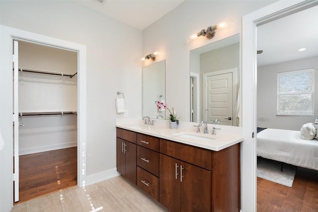 bathroom with vanity and hardwood / wood-style flooring