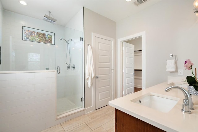 bathroom with vanity and walk in shower