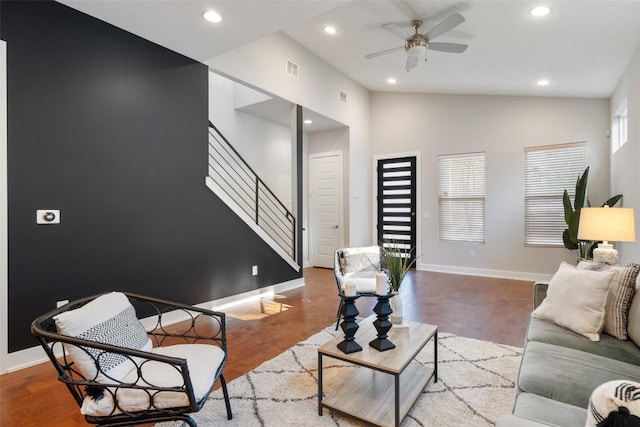 living room with wood-type flooring, high vaulted ceiling, and ceiling fan