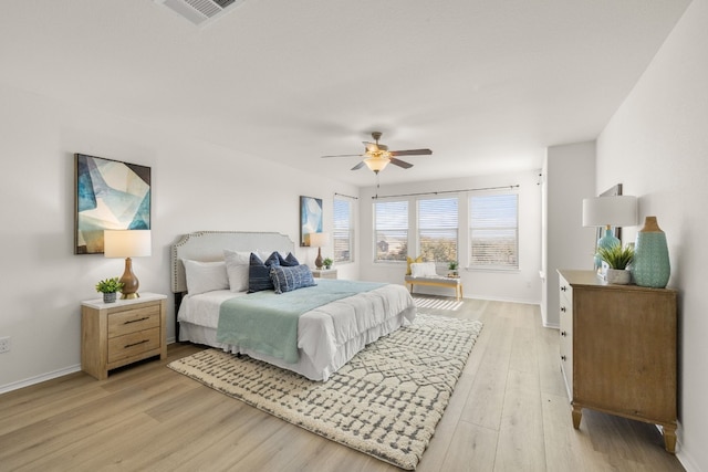 bedroom with light wood-type flooring and ceiling fan