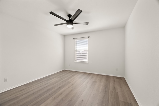 unfurnished room with light hardwood / wood-style flooring and ceiling fan