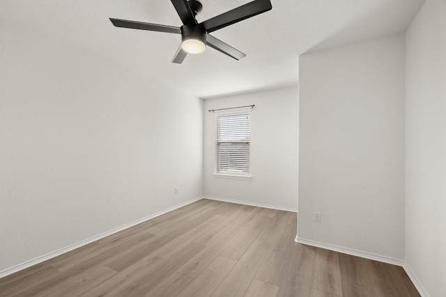 spare room with ceiling fan and light hardwood / wood-style floors