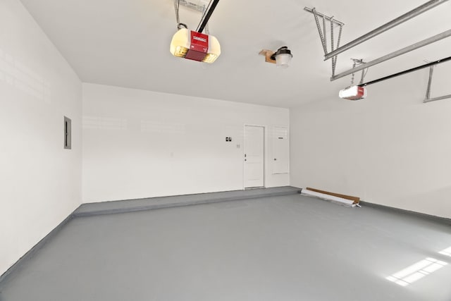 garage featuring a garage door opener and electric panel