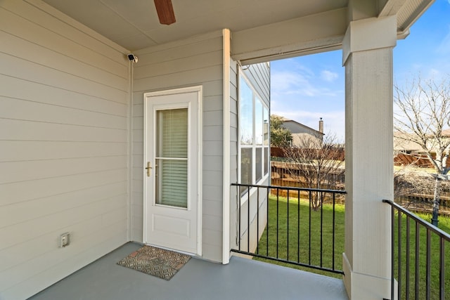 property entrance with a lawn