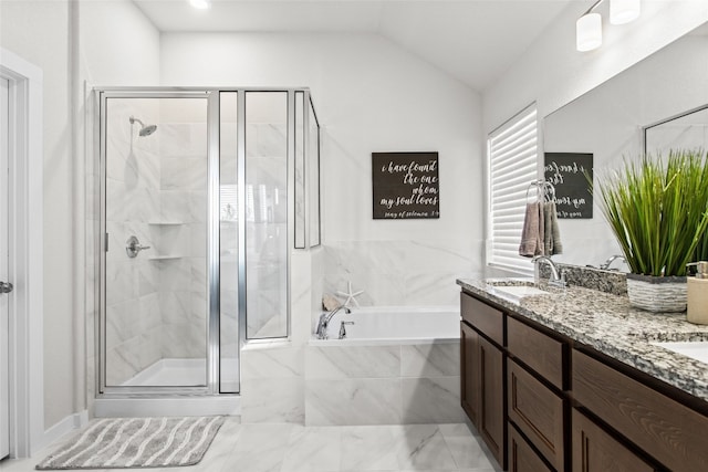 bathroom featuring vanity, vaulted ceiling, and plus walk in shower