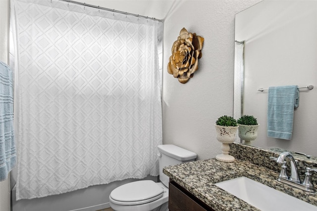 full bathroom featuring vanity, toilet, and shower / tub combo