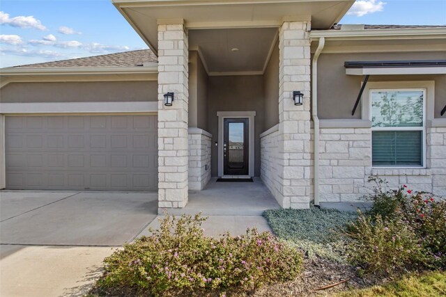 doorway to property featuring a garage