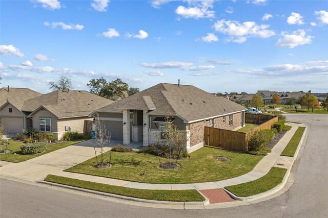 view of front of home with a garage and a front yard