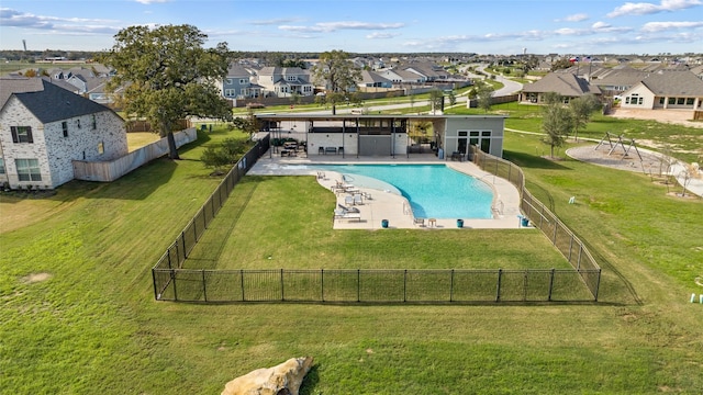 view of swimming pool featuring a lawn and a patio area