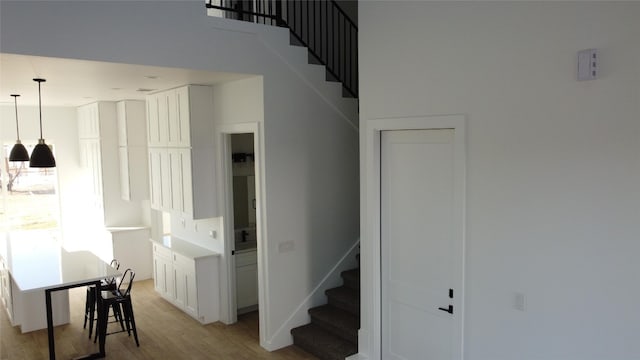 stairs with hardwood / wood-style flooring