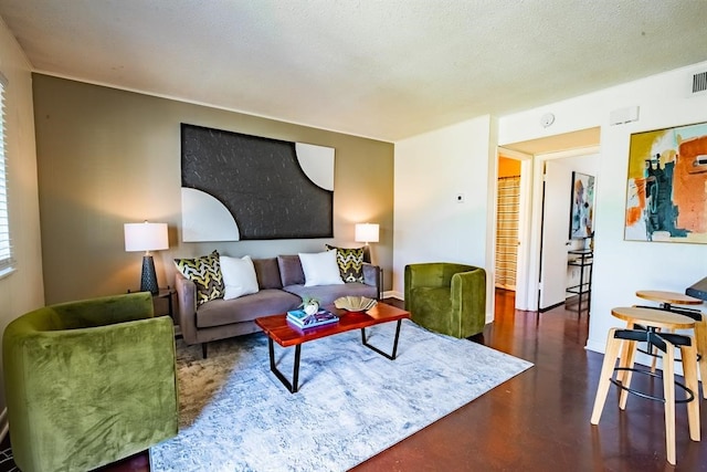 living room featuring a textured ceiling