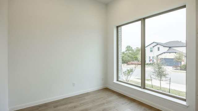 spare room with light wood-type flooring