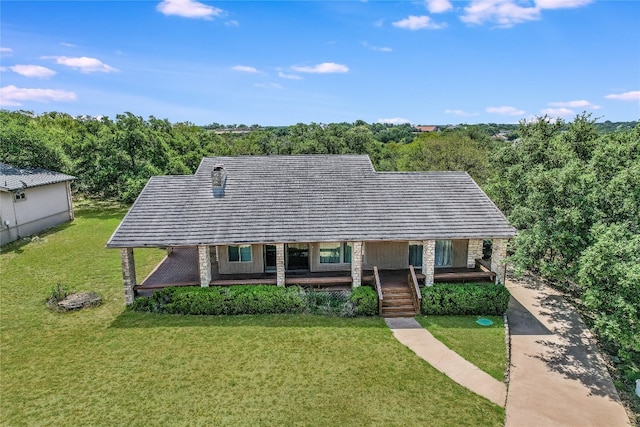 view of front of house with a porch and a front yard