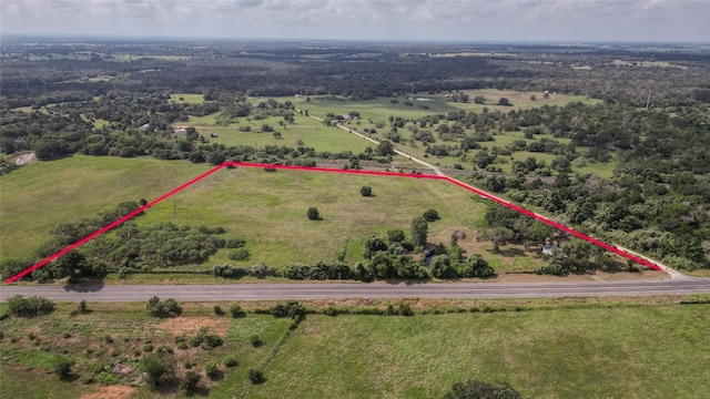 birds eye view of property with a rural view