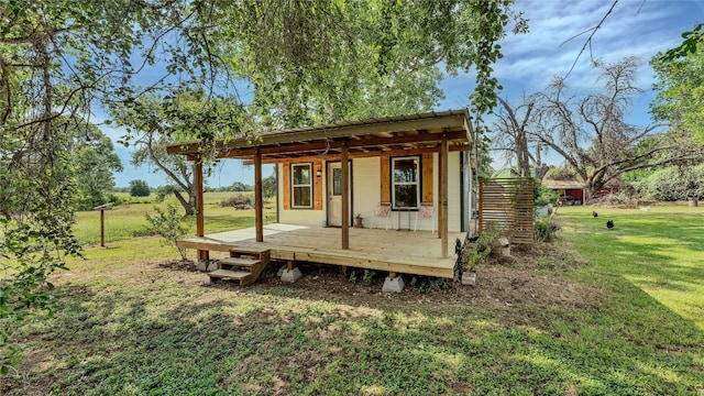 view of outdoor structure featuring a lawn and a pergola