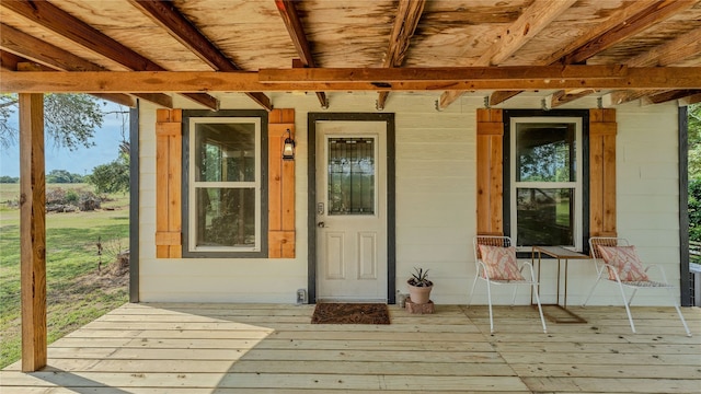 property entrance featuring a deck