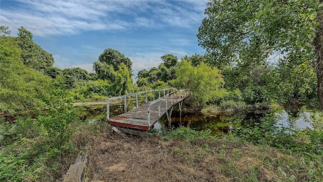 surrounding community featuring a water view