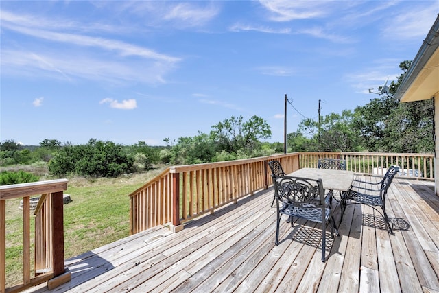 deck featuring a lawn