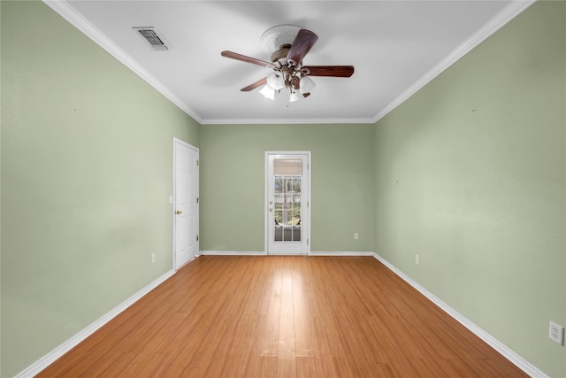 spare room featuring crown molding, ceiling fan, and light hardwood / wood-style floors