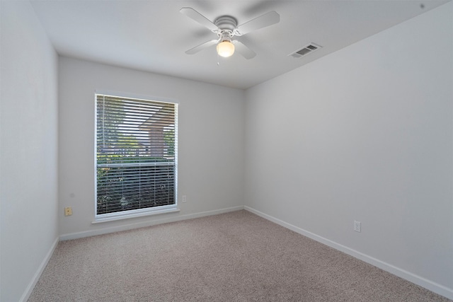 carpeted empty room with ceiling fan