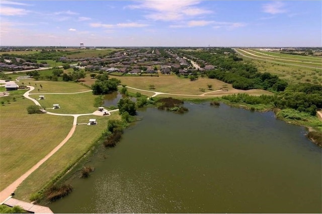 drone / aerial view featuring a water view and a rural view