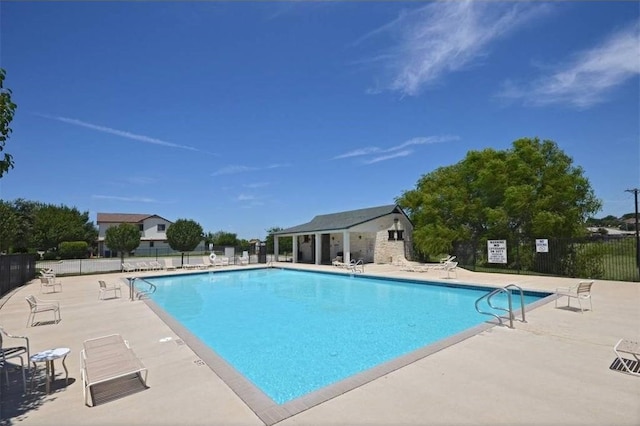 view of swimming pool featuring a patio