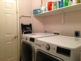 clothes washing area featuring washing machine and clothes dryer