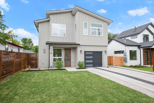 view of front facade with a garage and a front lawn