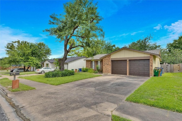 single story home with a front yard and a garage