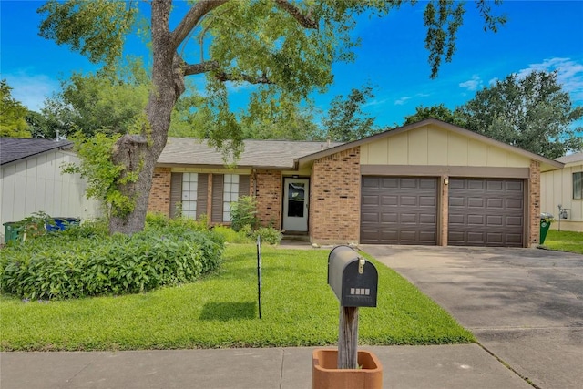 ranch-style home featuring a front lawn and a garage