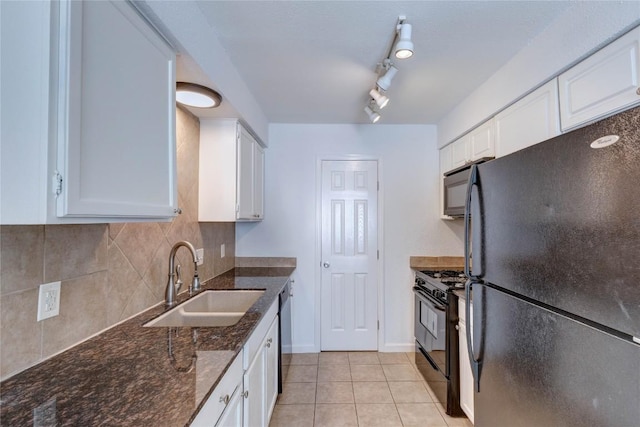 kitchen with black appliances, white cabinetry, and sink