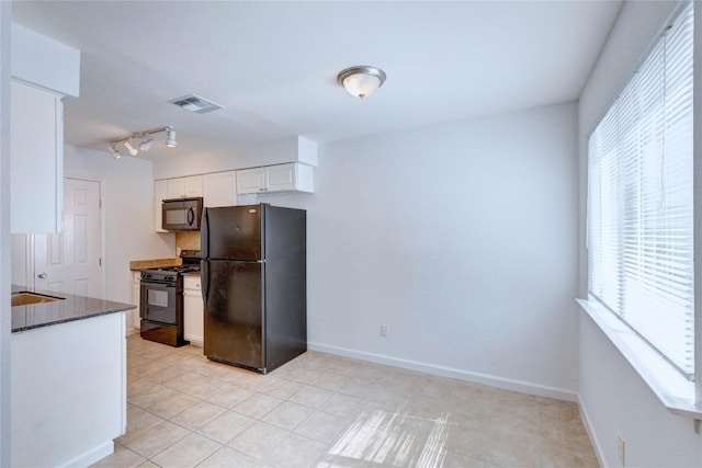 kitchen featuring white cabinetry and black appliances