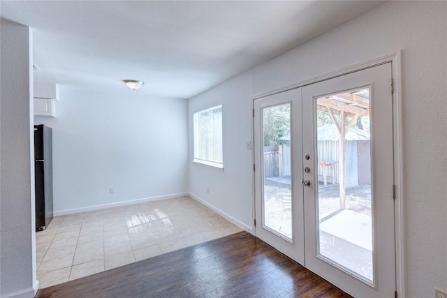 doorway to outside featuring light wood-type flooring and french doors