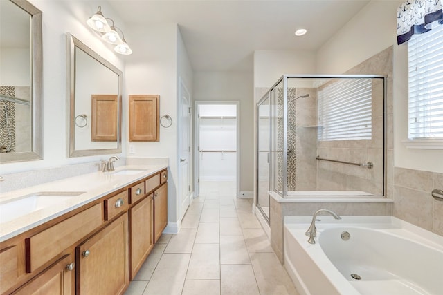 bathroom with vanity, shower with separate bathtub, and tile patterned floors