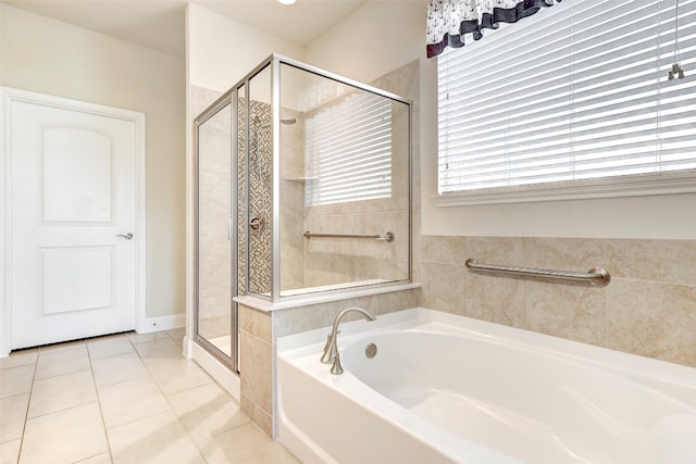 bathroom with plus walk in shower and tile patterned flooring