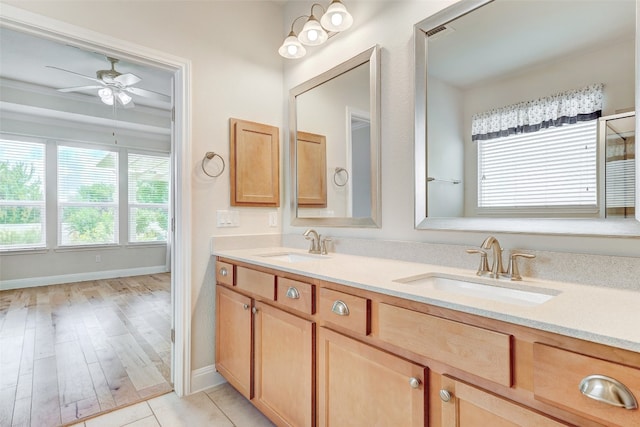 bathroom with vanity, ceiling fan, and hardwood / wood-style flooring