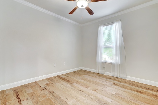 spare room featuring light wood-type flooring, ceiling fan, and crown molding