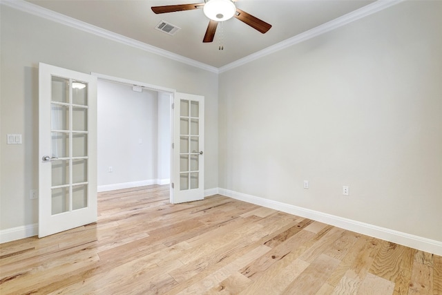 empty room with light hardwood / wood-style flooring, ceiling fan, french doors, and crown molding