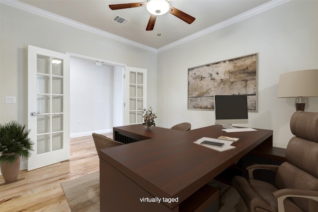 office featuring ceiling fan, light hardwood / wood-style flooring, crown molding, and french doors