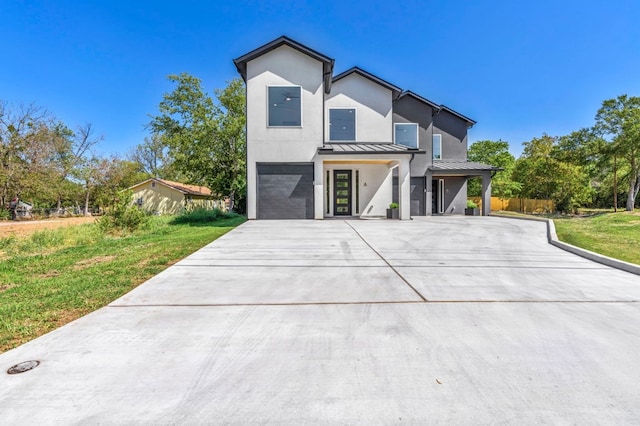 contemporary home featuring a front lawn