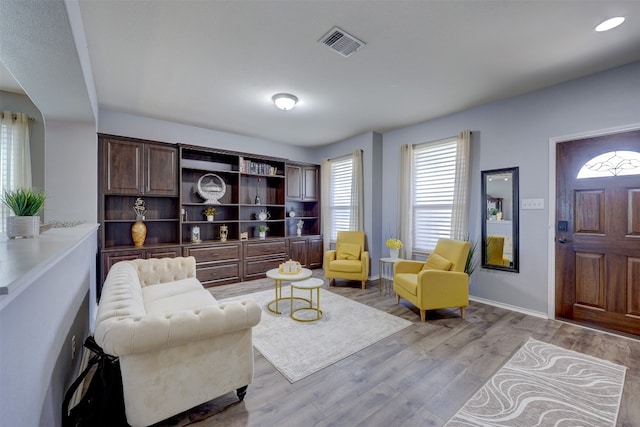 living room with light hardwood / wood-style flooring