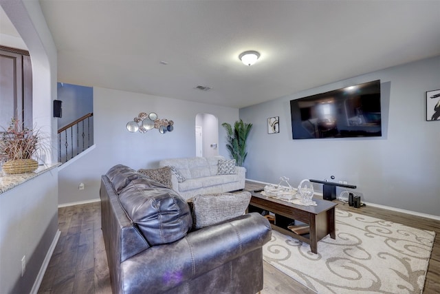 living room featuring dark wood-type flooring