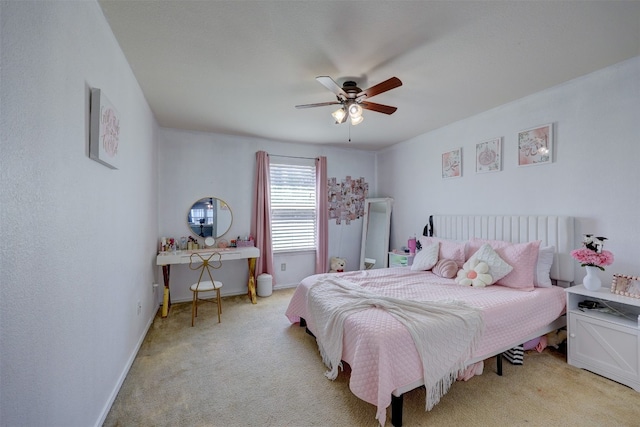 bedroom with ceiling fan and light colored carpet