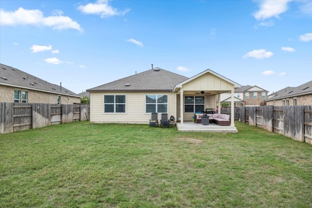 back of house with ceiling fan, a yard, outdoor lounge area, and a patio